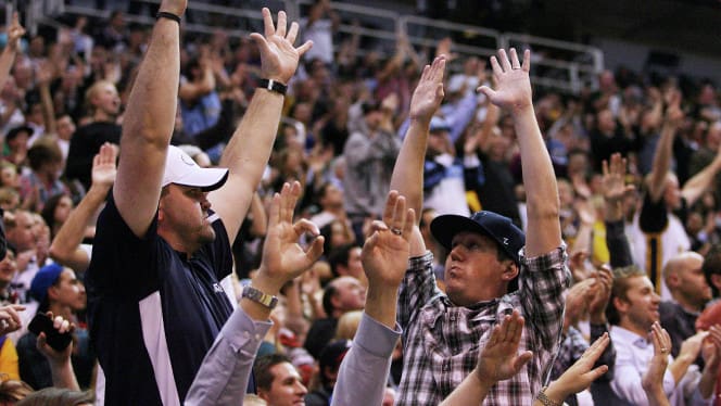 Jazz fans cheer during a game