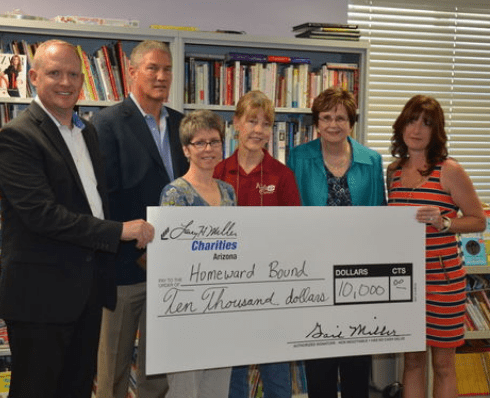 LHM Dealerships and Charities write a check for $10,000 to Phoenix’s Homeward Bound on Aug. 21 for the organization’s “Success Through Literacy”